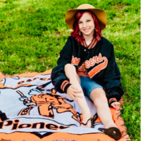  Journey Gould sitting on Pioneer blanket